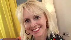 Sexy blonde GILF, Koko, gets naked, revealing her slender body