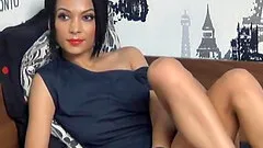 Sexy brunette babe on webcam stripteasing and playing with her huge tits