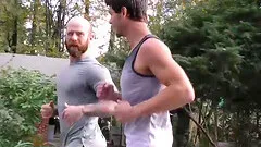 Older tattooed muscle daddy coaches virgin friend on thick cock