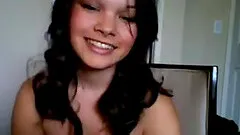 Hot busty brunette on webcam teasing and seducing with her sexy boobs