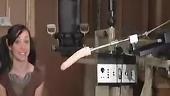 Cutie with a big tattoo enjoys being fucked with a sex machine