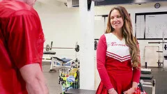 Cheerleader Brooke Beretta in uniform uses her body and fucks in the gym