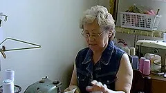 Hot grandma is playing naked with her hairy pussy and favourite toy
