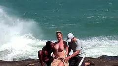 Hardcore interracial double penetration on the beach