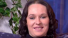 Skillful brunette enjoys plowing her pussy with a massive sex toy