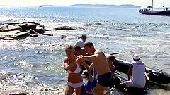 Lea Lazur's holes plowed well during a beach group sex session