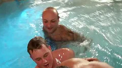 Alluring gay enjoying hot blowjob in the pool group sex