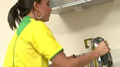 Sporty slut maturbates with a vibrator in the kitchen