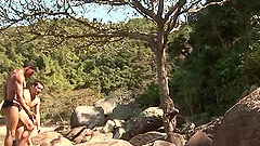 Latin stud sits on his boyfriends hard cock on the beach