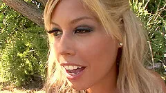Outdoor blowjob and doggy style pounding for a busty blonde babe