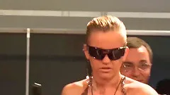 Horny blonde big boob babe squirt on public sex fair show stage