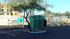 Teen swallows strangers cum in porta potty gloryhole in public parking lot
