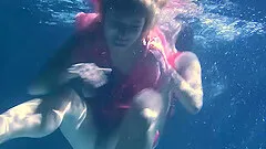 Two delicious and naked sluts make out while diving