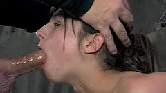 Skinny Kristine is tied up and deepthroated in the sex dungeon