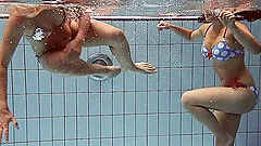 Two saucy honeys Iva and Paulinka strip down in the pool