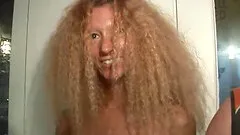 Long hair babe seductively displaying her juicy pussy in club