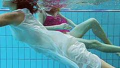 Hot fillies enjoy fooling around under the water while being naked