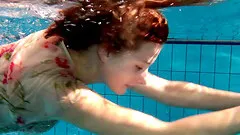 Sexy bombshell gets into the pool completely naked