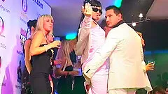 Music plays as drunk club whores suck on big cocks