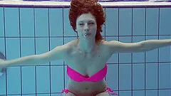 Superb shoot of natural tits redhead dame swimming in pool