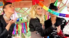 Classy women have fun making a mess at an outdoor party