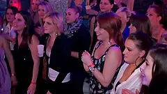 Dozens of beauties dance and fool around at a hot night club