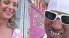 Cougar with fake tits awarding big black cock blowjob in interracial sex