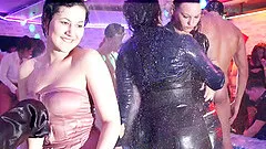 Hot drunk girls dance in the wet part of the night club