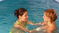 Alluring lesbian teen messing around in the swimming pool hardcore