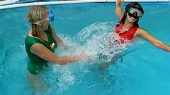Passionate lesbian couple enjoy playing in the pool before fucking with toys outdoors