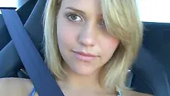 Fantastic blonde teen pinching her nipples in the car