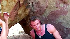 Behind the rocks at the beach with a bleach blonde bimbo