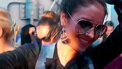 Barbaric women wrangle themselves unceremoniously with a huge crowd in a close up shoot