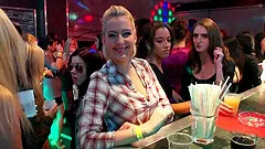 Mature brunette and a sassy blonde getting intimate in a club lesbian video shot.