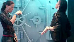 Girls in sexy club clothes dancing under the flow of water