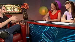 Bearded male porn star with glasses chatting backstage