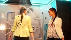 Bubbly cowgirls dance seductively under a shower and get soaked wet