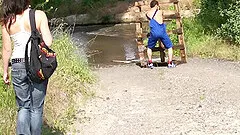Teen riding a cock and receiving a cumshot under a bridge