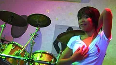 Sexy babe erotically strips to th e soothing beats of the music