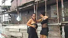 Affectionate lesbian couple taking their romance to the sea