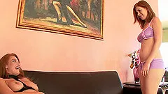 Two sexy brunettes are using a kinky toy in their lesbian adventure