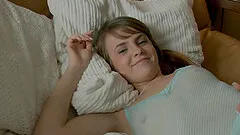 Adorable busty teen lies on her bed and fucks her muff using a sex toy