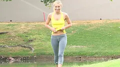 Jogging on the golf course and flashing the golfers