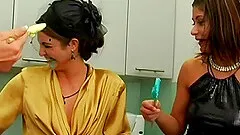 All girl food fight with green frosting covering them