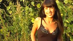 Tyra gets naked in the forest and massages her tender clit