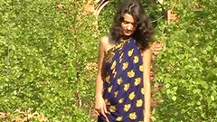 Skinny teen is naked in no time as she strips outdoors