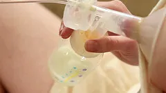 Beauty pumps her breast milk before fucking her man in bed