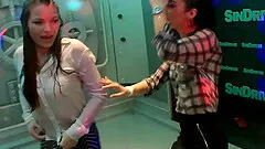 Extravagant babes getting naked under the stream of water