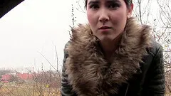 Cutie in a fur trimmed coat sucks his cock in the car