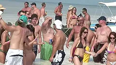 Topless beach party girls enjoy the attention their tits get